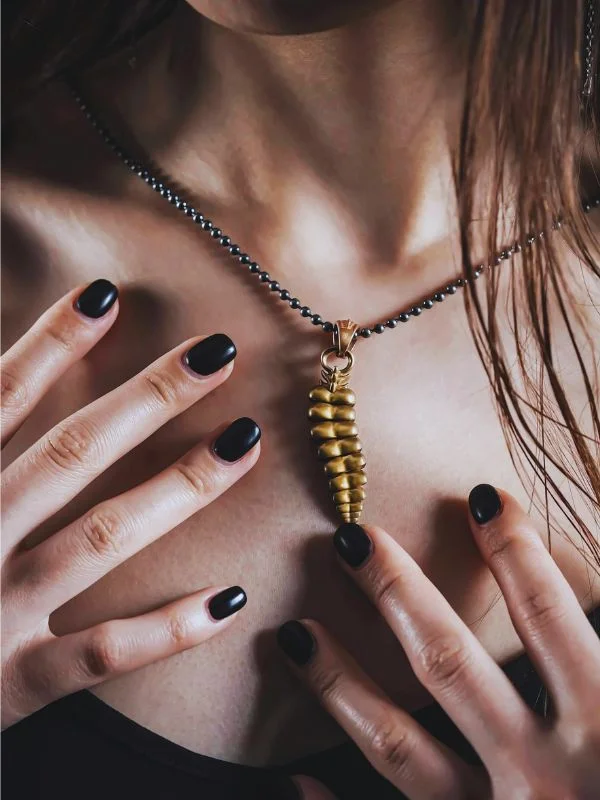 Photo by COPPERTIST WU httpswww.pexels.comphotoclose-up-of-woman-with-golden-dragon-tail-necklace-15947169 (1)